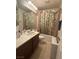 Small bathroom featuring a vanity with sink and a shower-tub combination at 11457 Steponia Bay St, Las Vegas, NV 89141