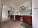 A primary bathroom vanity with double sinks and a large mirror at 11457 Steponia Bay St, Las Vegas, NV 89141