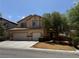 Charming two-story home with a spacious driveway, and a three-car garage at 11457 Steponia Bay St, Las Vegas, NV 89141