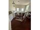 A beautiful staircase with railing and light fixtures lead to the first floor at 11457 Steponia Bay St, Las Vegas, NV 89141
