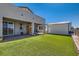 This backyard features a well-maintained lawn, patio, wooden sauna, and an external storage building at 130 W Fairway Rd, Henderson, NV 89015