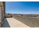 Balcony with stone wall offering panoramic views of the surrounding neighborhood and distant mountains at 130 W Fairway Rd, Henderson, NV 89015