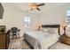 Inviting bedroom with natural light, features a bed, dresser, and a keyboard at 130 W Fairway Rd, Henderson, NV 89015