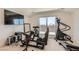 Bonus room with simulated driving setup, weights, and mountain view at 130 W Fairway Rd, Henderson, NV 89015