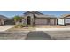 Charming home features a two-car garage and an RV garage, complemented by tasteful stone accents at 130 W Fairway Rd, Henderson, NV 89015