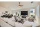 Bright living room seamlessly integrates a dining area, complete with modern furnishings and decor at 130 W Fairway Rd, Henderson, NV 89015