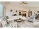 Bright living room seamlessly integrates a dining area and kitchen, complete with modern furnishings and decor at 130 W Fairway Rd, Henderson, NV 89015