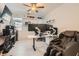 Office space with multi-screen setup, modern massage chair, bright lighting, and tile flooring at 130 W Fairway Rd, Henderson, NV 89015