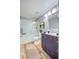 Bathroom featuring a glass-enclosed shower, modern vanity, and updated fixtures at 1308 Capri Dr # D, Boulder City, NV 89005