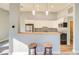 Modern kitchen featuring white cabinets, granite countertops, stainless steel appliances and hardwood floors at 1308 Capri Dr # D, Boulder City, NV 89005