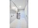 Utility room with tiled floor, storage cabinets, and a new water heater at 1308 Capri Dr # D, Boulder City, NV 89005
