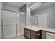 Bathroom featuring a glass enclosed shower stall, a vanity and a large mirror at 1405 S Nellis Blvd # 2117, Las Vegas, NV 89104