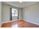 Bedroom featuring hardwood floors, neutral color palette, and a window offering views at 1405 S Nellis Blvd # 2117, Las Vegas, NV 89104