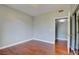 Bedroom with hardwood floors, a large closet with mirrored doors, and neutral paint at 1405 S Nellis Blvd # 2117, Las Vegas, NV 89104