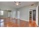 An open bedroom boasts hardwood floors, mirrored closet doors and a ceiling fan at 1405 S Nellis Blvd # 2117, Las Vegas, NV 89104