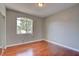 Bedroom featuring gleaming hardwood floors, light-colored walls and a large window at 1405 S Nellis Blvd # 2117, Las Vegas, NV 89104