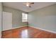 Bedroom featuring gleaming hardwood floors, light-colored walls and a ceiling fan at 1405 S Nellis Blvd # 2117, Las Vegas, NV 89104