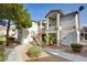 Attractive condominium building featuring a private entry staircase, stucco walls, and terracotta tiled roof at 1405 S Nellis Blvd # 2117, Las Vegas, NV 89104
