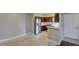 Modern kitchen features stainless steel appliances, tile floors, and breakfast bar at 1405 S Nellis Blvd # 2117, Las Vegas, NV 89104