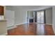 Living room featuring hardwood floors, neutral walls, fireplace, and glass doors to balcony at 1405 S Nellis Blvd # 2117, Las Vegas, NV 89104