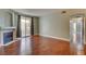 Living room features hardwood floors, neutral walls, fireplace, and glass doors to balcony at 1405 S Nellis Blvd # 2117, Las Vegas, NV 89104