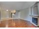 Spacious living room features hardwood floors, neutral walls, and a fireplace at 1405 S Nellis Blvd # 2117, Las Vegas, NV 89104