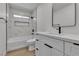 Modern bathroom with marble tile, sleek vanity, and updated fixtures at 1638 Candice St, Las Vegas, NV 89156