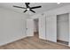 Bedroom featuring a sliding door closet, ceiling fan, and doorway leading to another room at 1638 Candice St, Las Vegas, NV 89156
