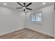 Bright bedroom with a ceiling fan and a window overlooking the exterior at 1638 Candice St, Las Vegas, NV 89156