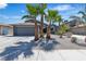 Charming single-story home featuring a well-maintained front yard, palm trees, and a two-car garage at 1638 Candice St, Las Vegas, NV 89156