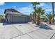 Charming single-story home featuring a long driveway and mature palm trees at 1638 Candice St, Las Vegas, NV 89156