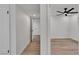 Hallway with a doorway leading to a bedroom with a ceiling fan at 1638 Candice St, Las Vegas, NV 89156