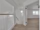 Upstairs hallway leading to a bedroom with light wood floors at 1638 Candice St, Las Vegas, NV 89156