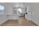 Bright kitchen featuring white cabinets, marble countertops, stainless appliances, and hardwood floors at 1638 Candice St, Las Vegas, NV 89156