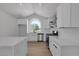 Newly remodeled kitchen featuring an arched window, white marble counters, and stainless steel appliances at 1638 Candice St, Las Vegas, NV 89156