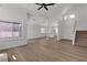 Open living room features new floors, light walls, and staircase with carpet steps leading to the second floor at 1638 Candice St, Las Vegas, NV 89156