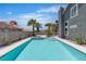 Backyard pool featuring blue water, palm trees, and an attached hot tub at 1638 Candice St, Las Vegas, NV 89156