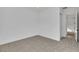 Empty room featuring plush carpeting, a bright window, and neutral walls offering a blank canvas for personal design at 164 Cabo Cruces Dr, Henderson, NV 89011