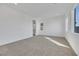 A large, carpeted bedroom features natural light with its big windows and bright, neutral walls at 164 Cabo Cruces Dr, Henderson, NV 89011