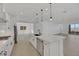 Well-equipped kitchen showcases a waterfall island, stainless appliances, and sleek hardware at 164 Cabo Cruces Dr, Henderson, NV 89011