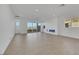 Spacious living room with tile floors, recessed lighting, and access to an outdoor patio at 164 Cabo Cruces Dr, Henderson, NV 89011