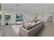 Open-concept living room featuring a sleek fireplace and seamless connection to the modern kitchen at 164 Cabo Cruces Dr, Henderson, NV 89011
