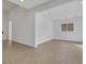 Expansive living room with neutral tones and sleek tile flooring at 164 Cabo Cruces Dr, Henderson, NV 89011