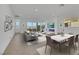 Bright living room with large windows, contemporary furniture, and an electric fireplace at 164 Cabo Cruces Dr, Henderson, NV 89011
