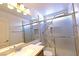 Bathroom with modern vanity, large mirror, and glass-enclosed shower at 1721 Mill Canyon Dr, Las Vegas, NV 89128