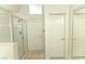 Bright bathroom featuring a shower, toilet and closets at 1721 Mill Canyon Dr, Las Vegas, NV 89128