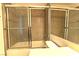 Bathroom featuring bathtub and shower, glass sliding doors, and vanity at 1721 Mill Canyon Dr, Las Vegas, NV 89128