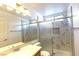 Bathroom featuring a shower, a sink with mirror, and windows at 1721 Mill Canyon Dr, Las Vegas, NV 89128
