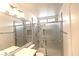 Modern bathroom featuring marble-tiled shower with glass doors, bright lighting, and neutral color palette at 1721 Mill Canyon Dr, Las Vegas, NV 89128