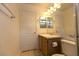Traditional bathroom featuring a vanity with sink, mirror, and toilet at 1721 Mill Canyon Dr, Las Vegas, NV 89128